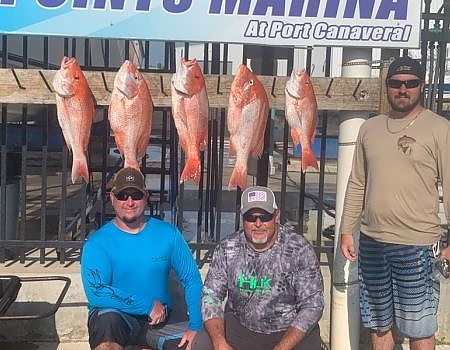  Posing onshore with their catch