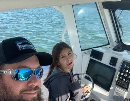  Captain and crew aboard boat